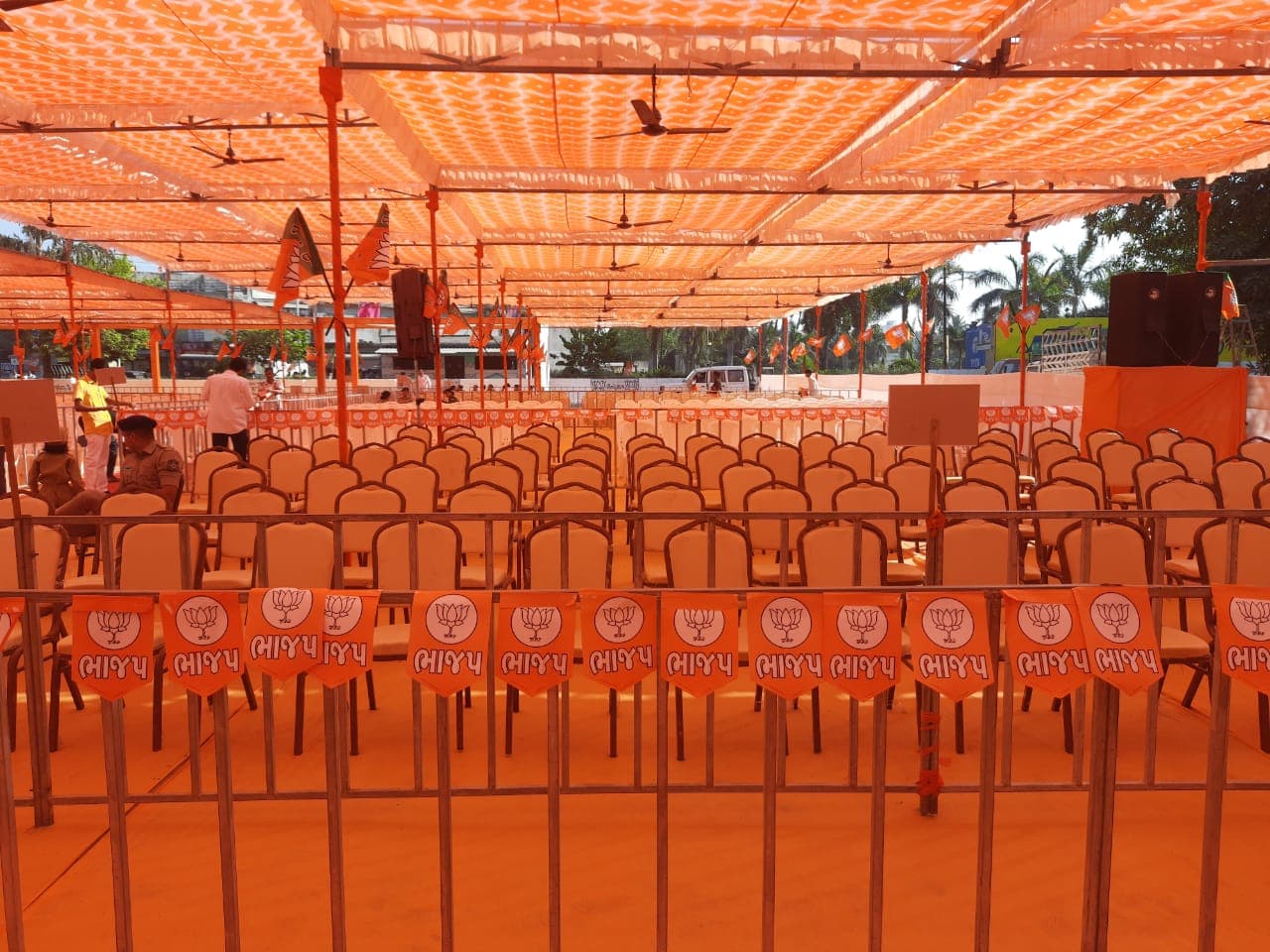 Party flag bunting lining the barricades in front of the seating area